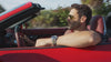 Man driving a convertible, watch close-up - catalog header